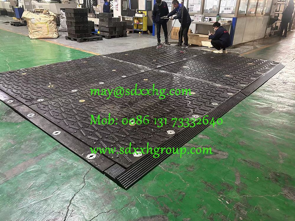 Over-lapping heavy duty composite construction road mats