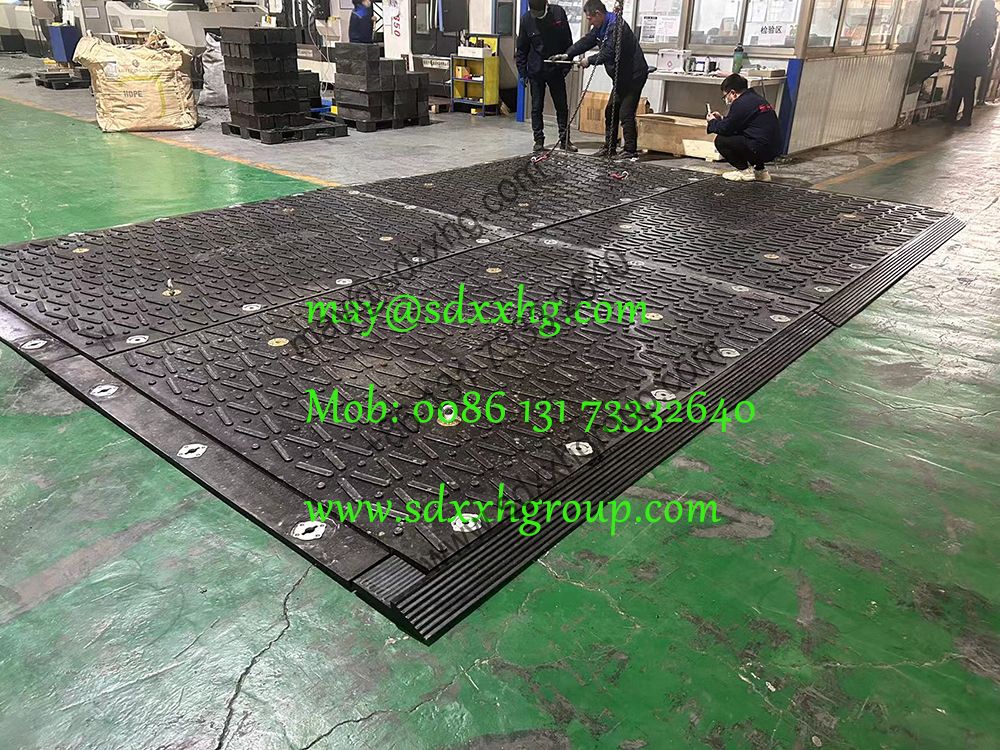 overlapping heavy duty unbreakable ground mats construction access